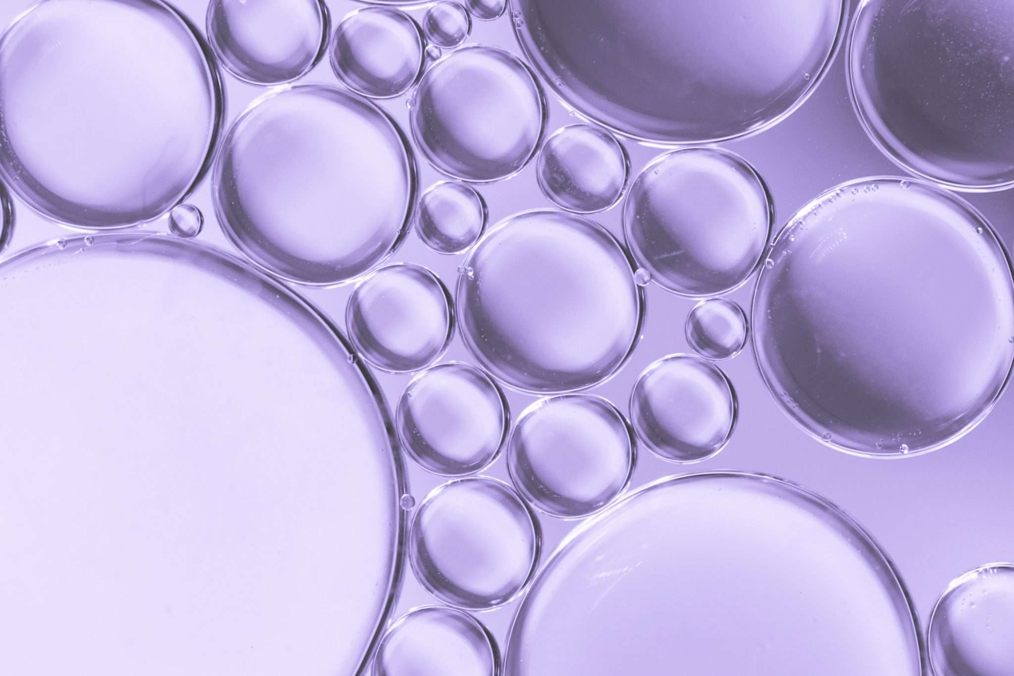 abstract-air-bubbles-liquid-lilac-colored-background-2048×1365